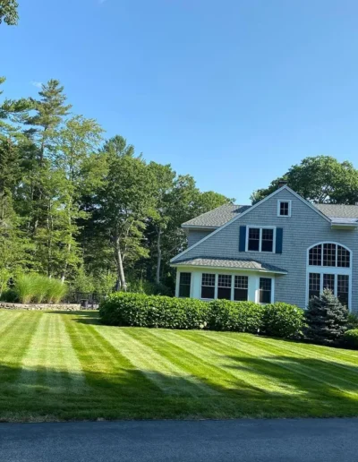 Manicured lawn in Greater Portland, landscaping by Anything Goes
